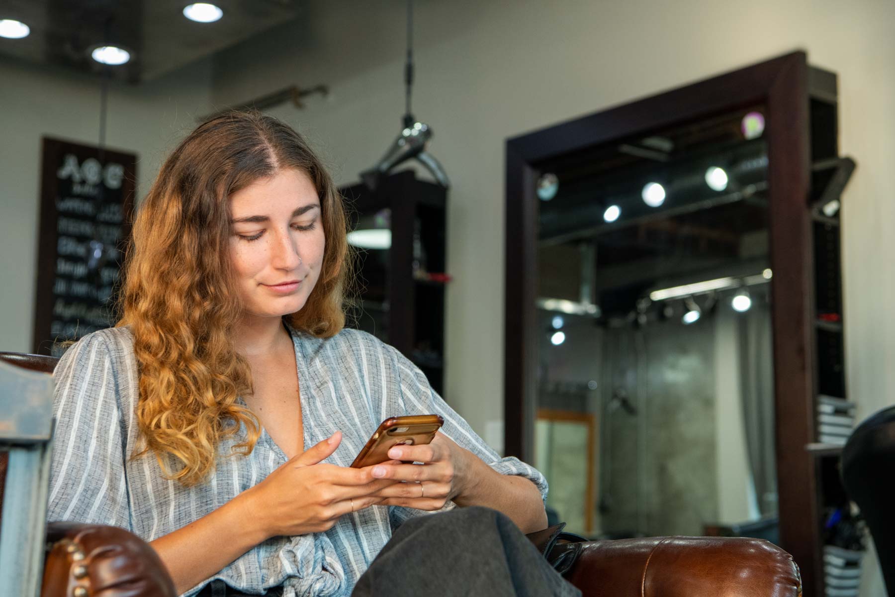 Magazine Jukebox lifestyle image of woman scrolling phone